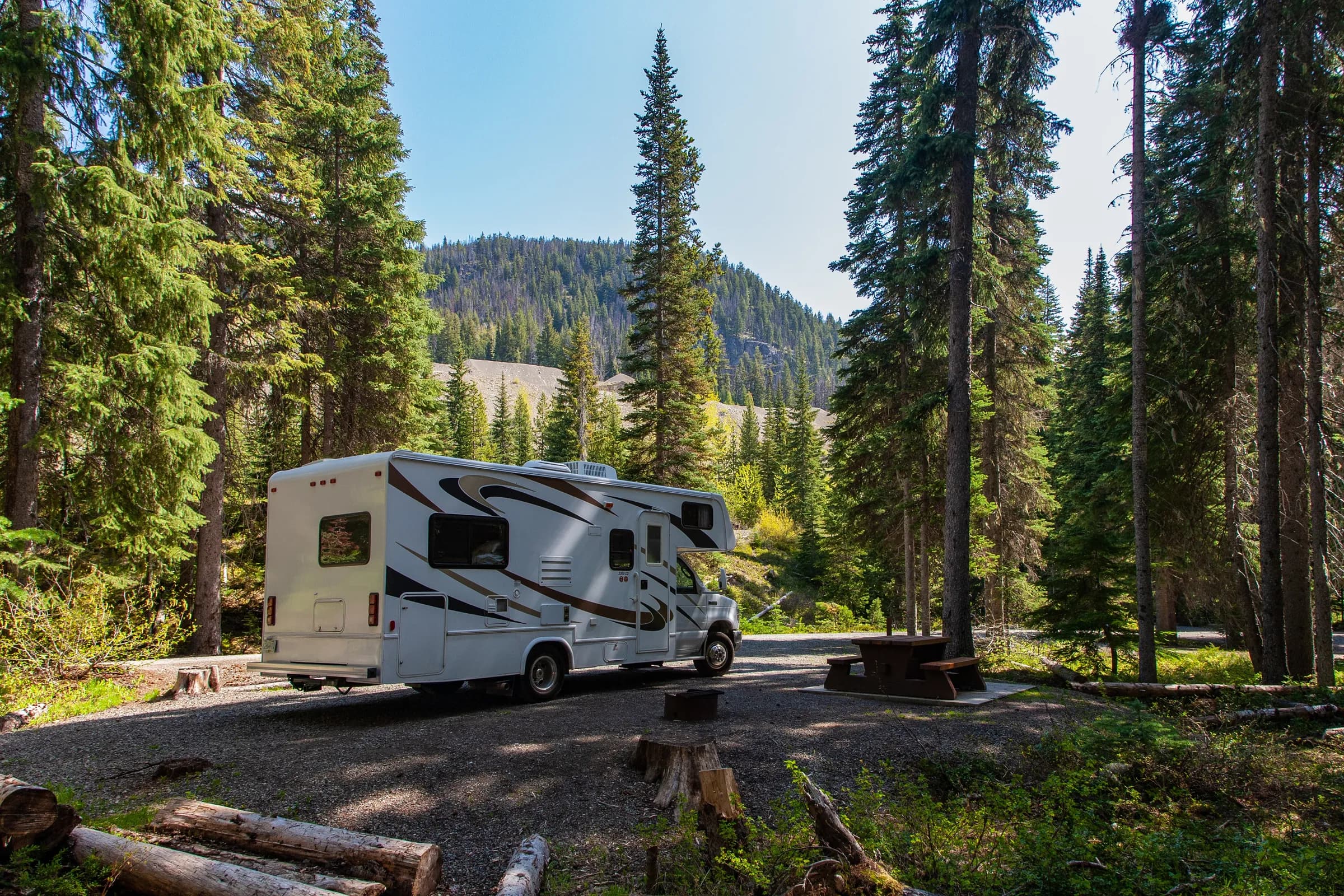 An RV at a mountain campsite